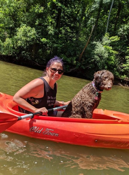 Amethyst and her dog on a kayak